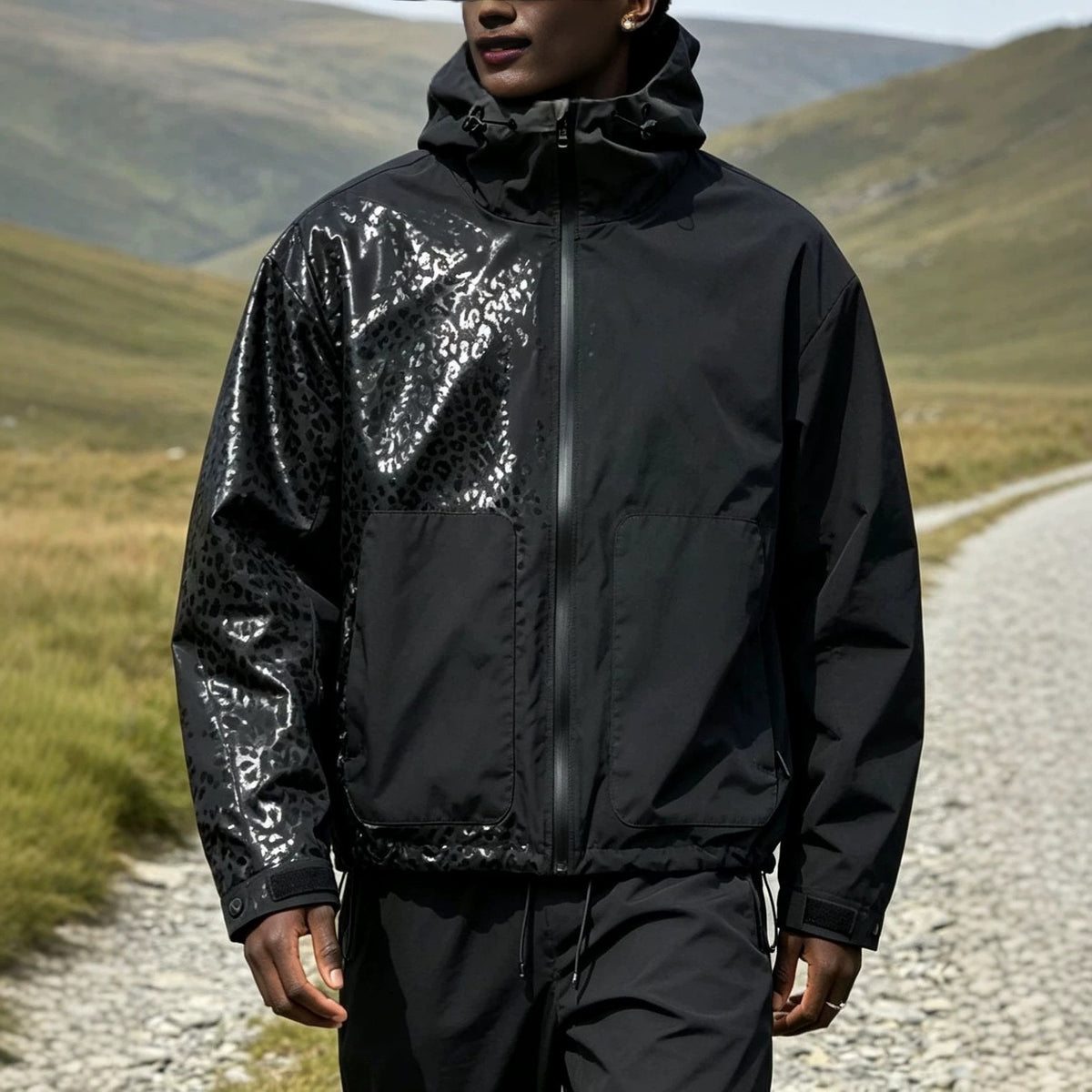 Water-reactive cheetah rain jacket