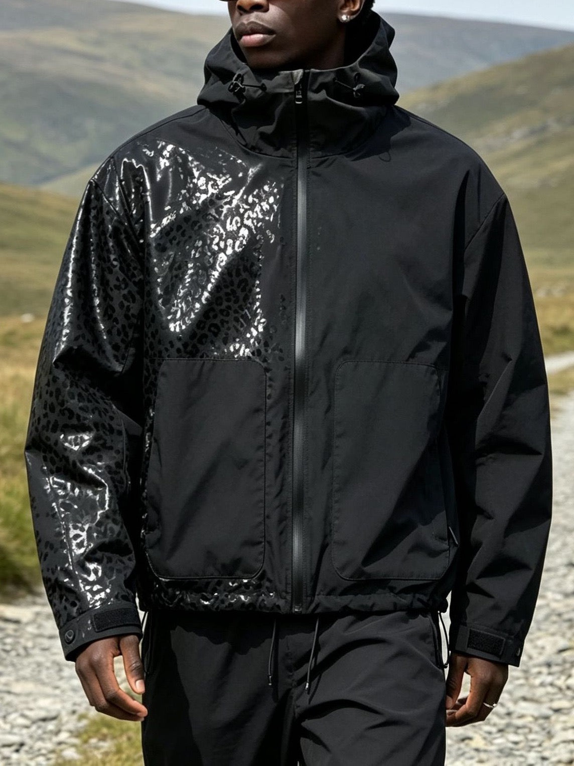 Water-reactive cheetah rain jacket